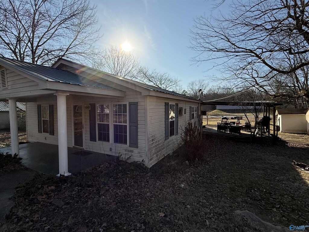 524 Long Hollow Rd, Scottsboro, AL 35768 - view of side of property featuring a patio area