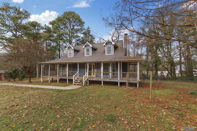 view of front of home with covered porch and a front lawn