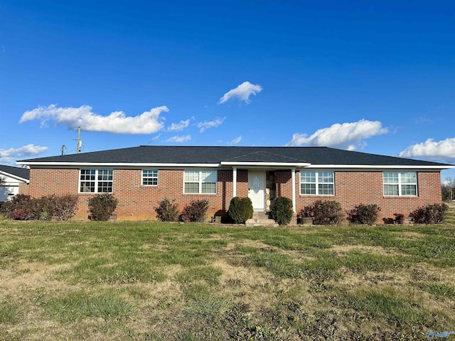 ranch-style home featuring a front yard