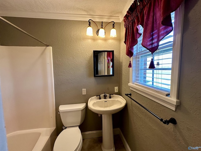 bathroom featuring a textured ceiling, toilet, and crown molding