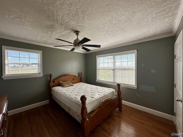 bedroom with a textured ceiling, dark hardwood / wood-style floors, and ceiling fan