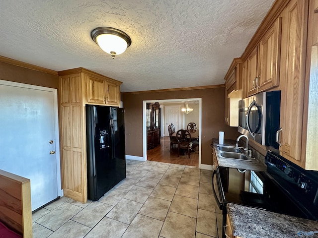 kitchen with sink, an inviting chandelier, light tile patterned flooring, black appliances, and ornamental molding