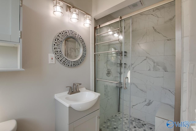 bathroom featuring vanity and walk in shower