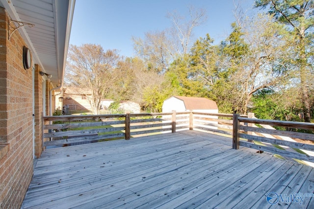 deck featuring an outdoor structure