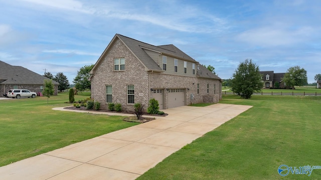 view of front of home with a garage and a front yard