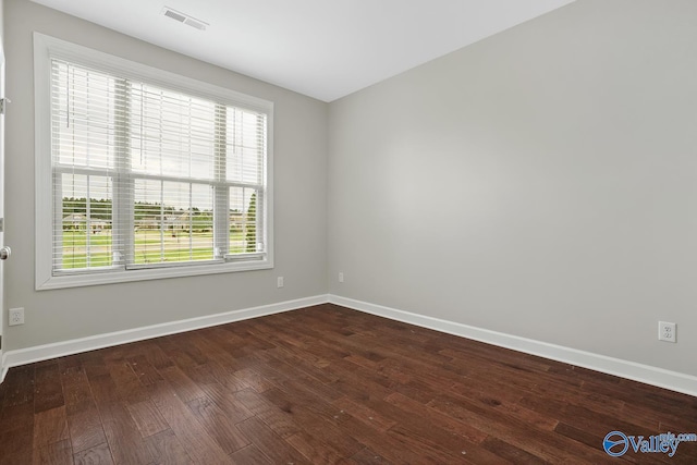 spare room featuring hardwood / wood-style floors