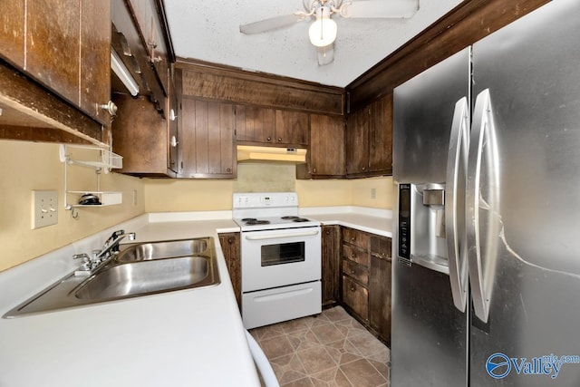 kitchen with white electric range oven, a sink, stainless steel fridge with ice dispenser, under cabinet range hood, and light countertops