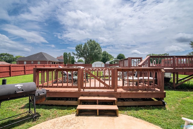 114 Sandi Paige Ln, Huntsville, AL 35811 - wooden terrace featuring a fenced backyard, a storage shed, and area for grilling