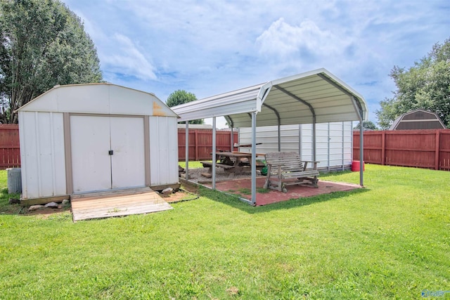 114 Sandi Paige Ln, Huntsville, AL 35811 - view of shed featuring a fenced backyard and a detached carport