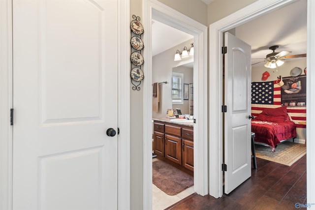 114 Sandi Paige Ln, Huntsville, AL 35811 - hallway featuring dark wood-type flooring and a sink