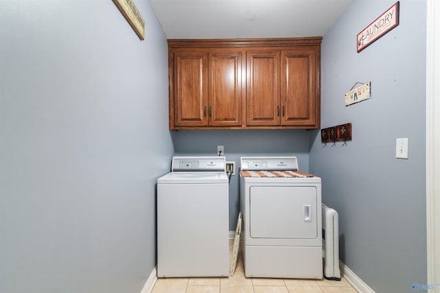 114 Sandi Paige Ln, Huntsville, AL 35811 - laundry room with washing machine and dryer, cabinet space, and light tile patterned floors