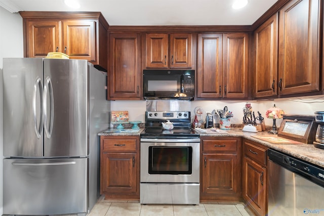 114 Sandi Paige Ln, Huntsville, AL 35811 - kitchen featuring stainless steel appliances, light tile patterned floors, and recessed lighting