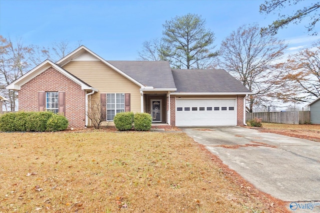 view of front facade with a garage and a front lawn