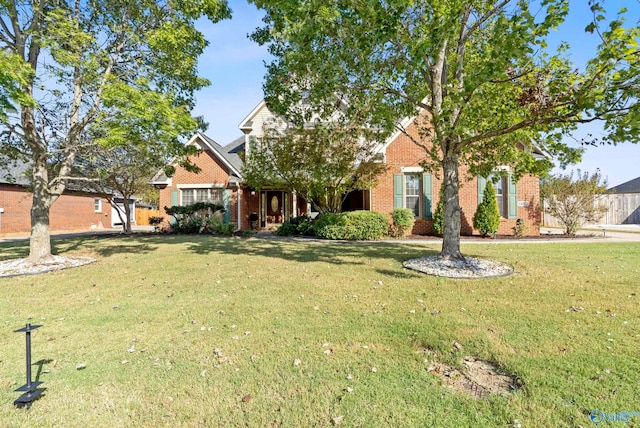 view of front of home featuring a front yard and a garage