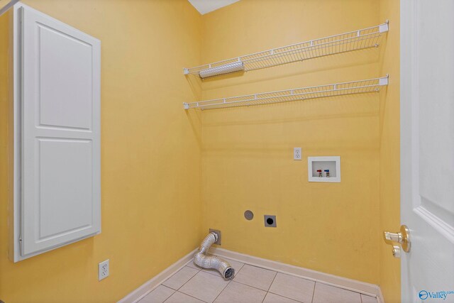 laundry area with washer hookup, hookup for an electric dryer, and light tile patterned floors