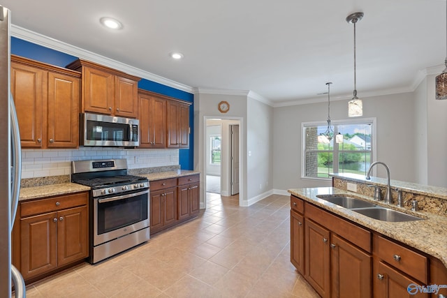 kitchen featuring light tile patterned floors, stainless steel appliances, decorative light fixtures, light stone counters, and sink