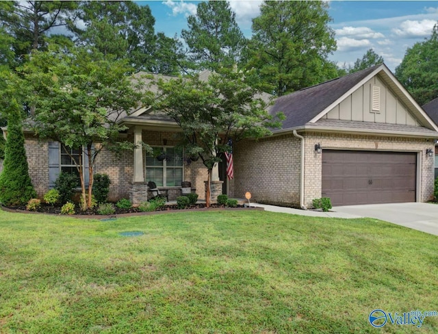 view of front of house with driveway, an attached garage, a front yard, board and batten siding, and brick siding