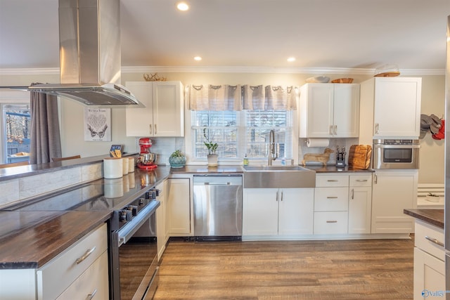 kitchen featuring sink, white cabinetry, stainless steel appliances, island range hood, and light hardwood / wood-style floors