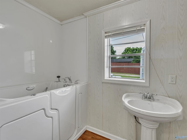 17441 E Limestone Rd, Athens, AL 35613 - full bathroom with a tub, ornamental molding, baseboards, wood finished floors, and a sink