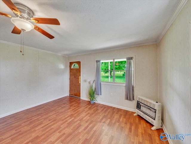 17441 E Limestone Rd, Athens, AL 35613 - spare room with heating unit, wood finished floors, crown molding, ceiling fan, and a textured ceiling