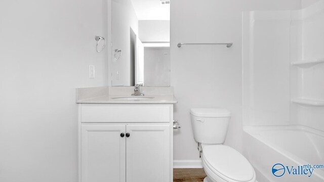 full bathroom with vanity, toilet, and bathtub / shower combination