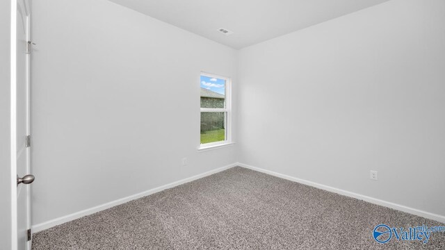 unfurnished room with carpet flooring