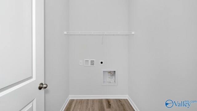 laundry area featuring hookup for an electric dryer, washer hookup, and light hardwood / wood-style floors