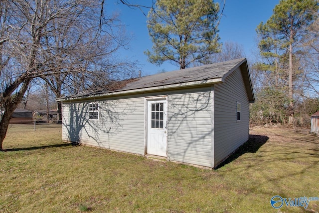 view of outdoor structure featuring a yard