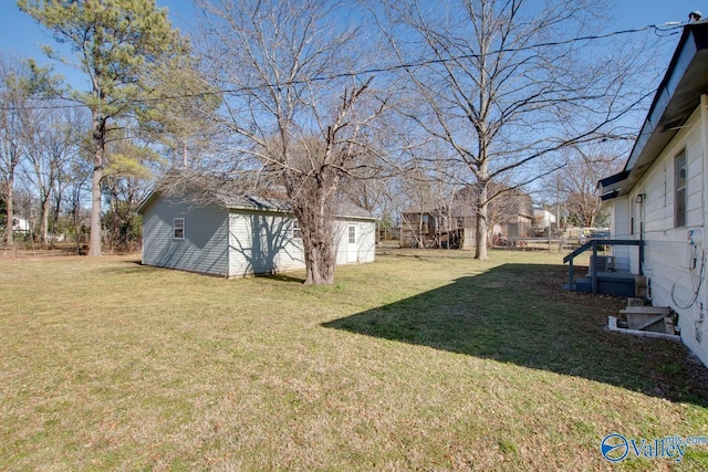 view of yard with an outdoor structure