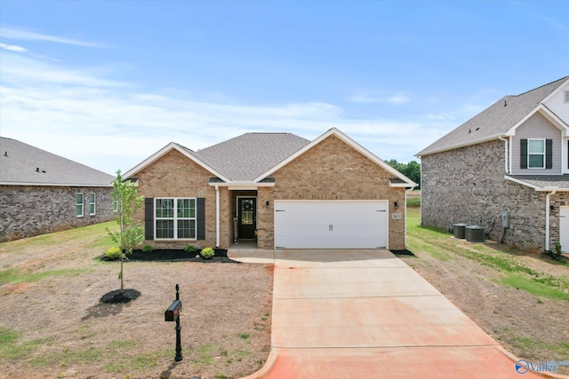 26674 Kyle Ln, Athens, AL 35613 - traditional home with concrete driveway, a garage, and brick siding