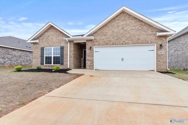 26674 Kyle Ln, Athens, AL 35613 - ranch-style home with driveway, brick siding, and a garage