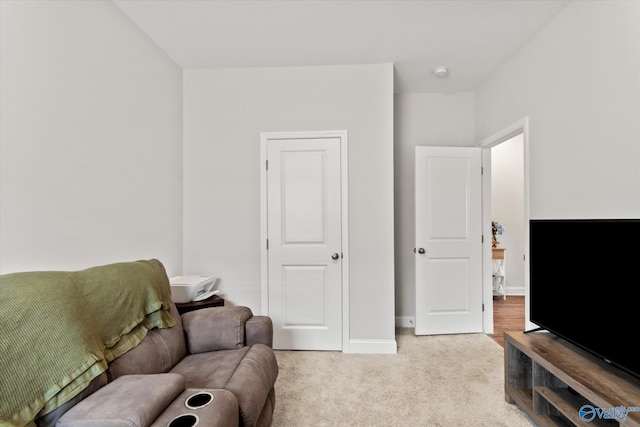 26674 Kyle Ln, Athens, AL 35613 - living area featuring light colored carpet and baseboards