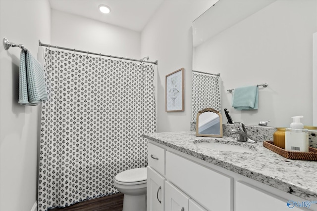 26674 Kyle Ln, Athens, AL 35613 - bathroom featuring toilet, vanity, wood finished floors, and curtained shower
