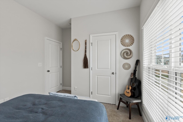 26674 Kyle Ln, Athens, AL 35613 - bedroom featuring light carpet and baseboards