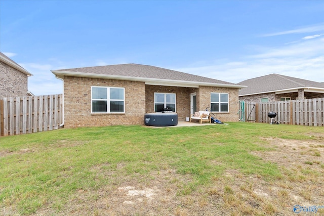 26674 Kyle Ln, Athens, AL 35613 - rear view of property featuring brick siding, a patio area, and roof with shingles