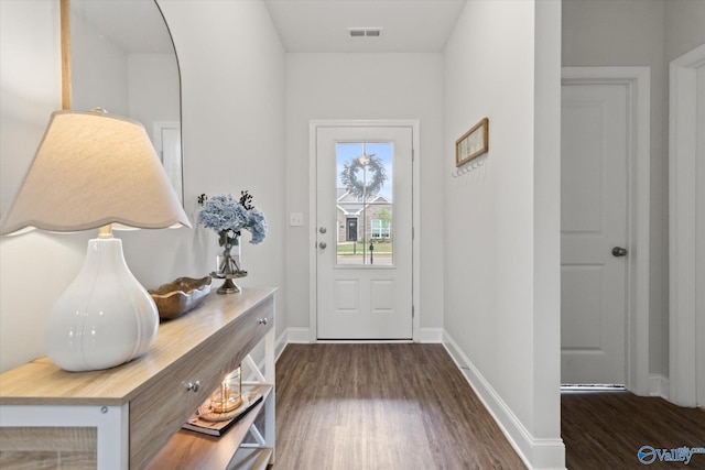 26674 Kyle Ln, Athens, AL 35613 - doorway to outside featuring dark wood-style flooring and baseboards