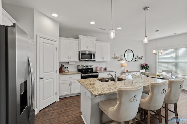 26674 Kyle Ln, Athens, AL 35613 - kitchen with appliances with stainless steel finishes, a sink, dark wood-style floors, white cabinets, and recessed lighting