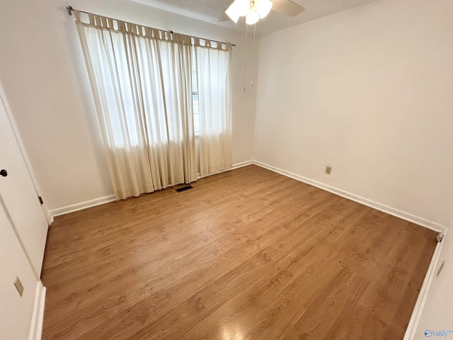 1313 Barry Rd, Anniston, AL 36206 - unfurnished room featuring baseboards, visible vents, wood finished floors, and ceiling fan