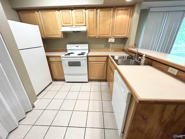 1313 Barry Rd, Anniston, AL 36206 - kitchen featuring white appliances, light brown cabinetry, light tile patterned floors, a sink, and a peninsula
