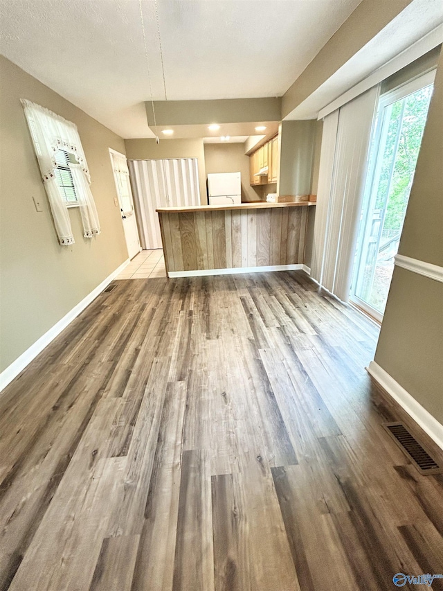 1313 Barry Rd, Anniston, AL 36206 - unfurnished living room featuring visible vents, dark wood-style flooring, and baseboards