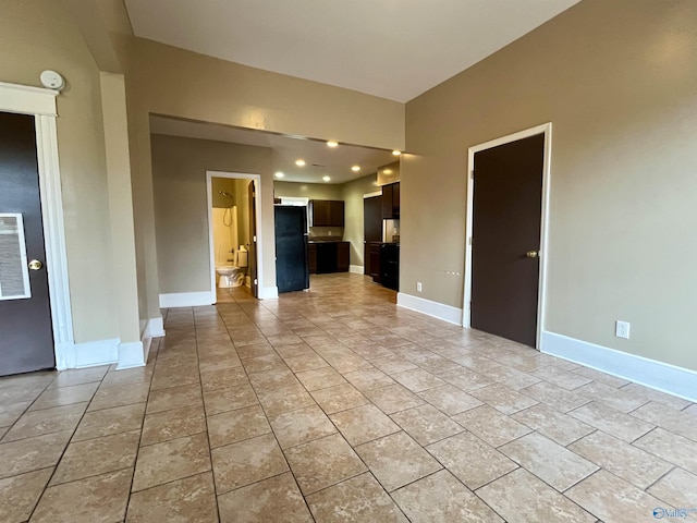 unfurnished living room with light tile patterned floors