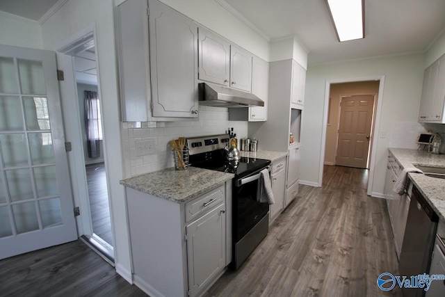 kitchen featuring light stone countertops, white cabinetry, appliances with stainless steel finishes, and crown molding