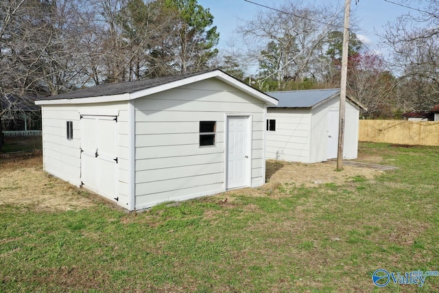 view of outdoor structure featuring a lawn