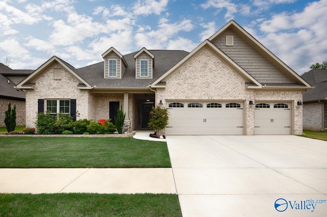 7514 Flint Crossing Cir, Owens Cross Roads, AL 35763 - view of front of house featuring an attached garage, concrete driveway, a front yard, brick siding, and a shingled roof