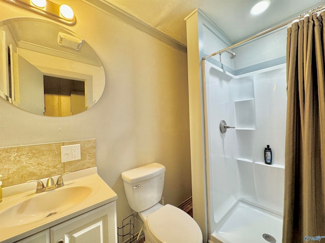 bathroom with vanity, decorative backsplash, a shower with shower curtain, and toilet