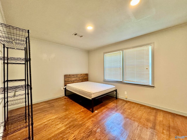 bedroom featuring hardwood / wood-style floors