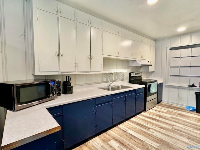 kitchen featuring white cabinetry, light wood-type flooring, blue cabinetry, sink, and stainless steel appliances