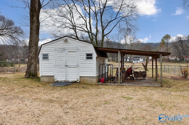 view of outbuilding with a lawn