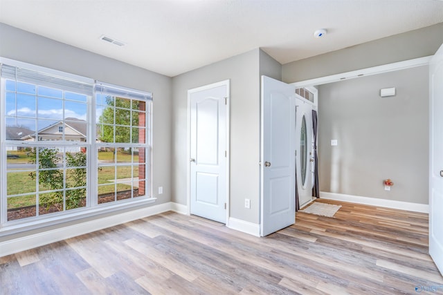 unfurnished bedroom with light wood-type flooring