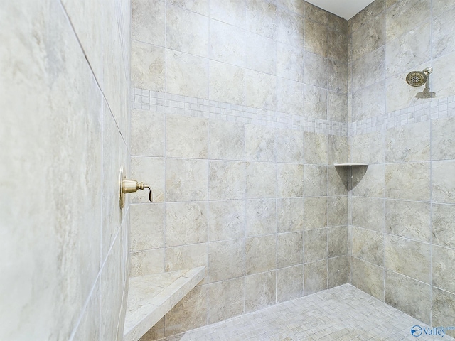 bathroom featuring tiled shower